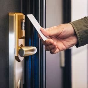 Person Accessing Hotel Room With Keycard